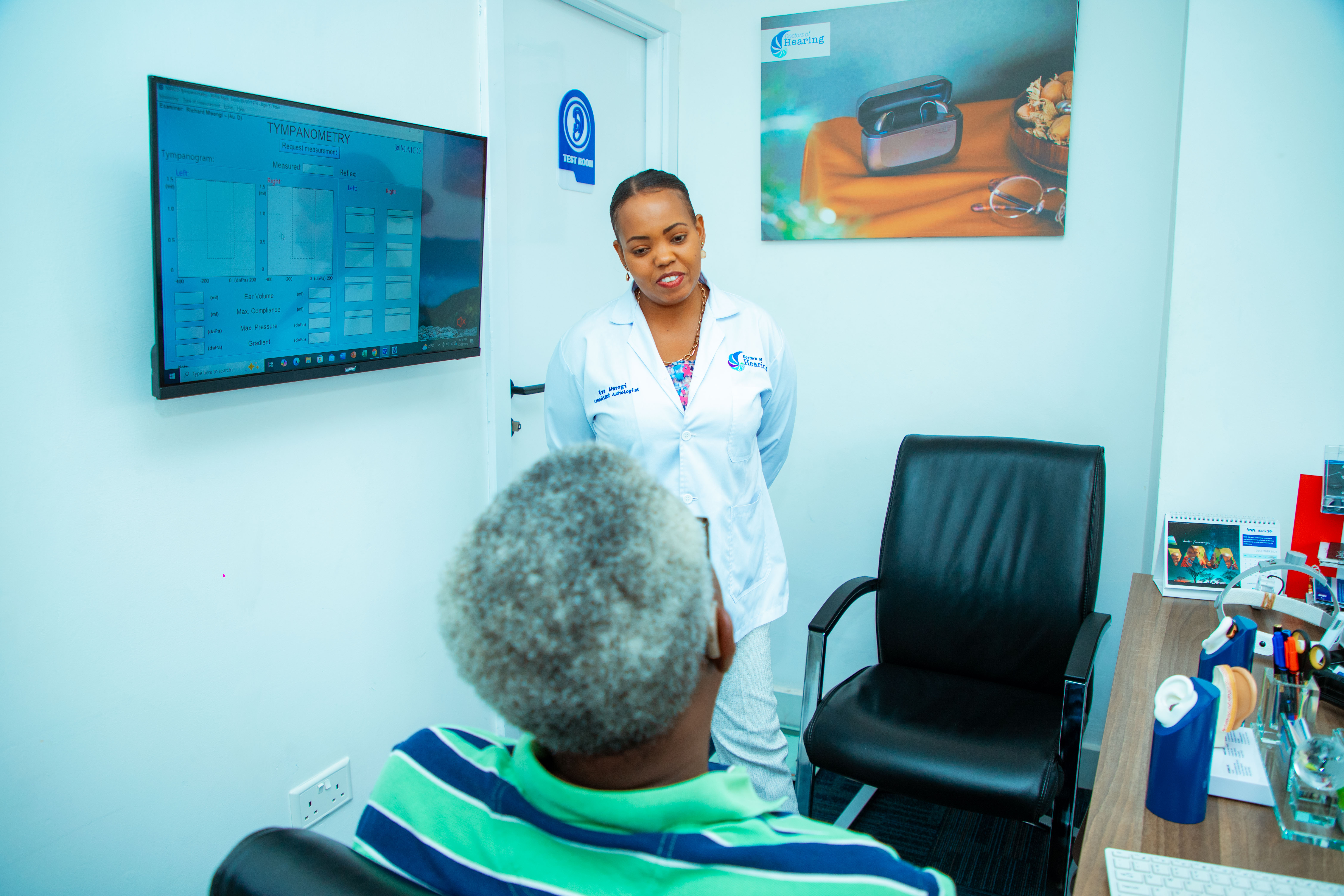 INCUSEAR clinician reviewing hearing test results
